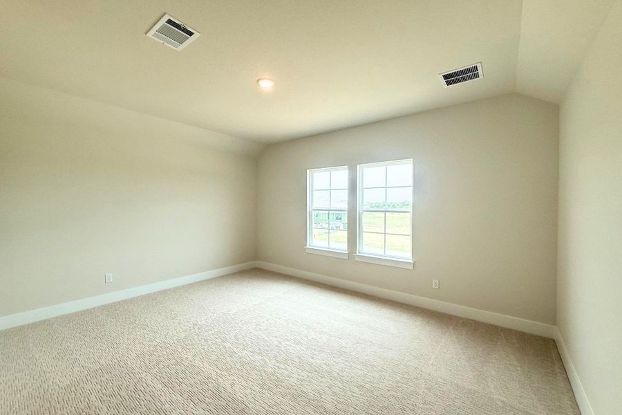 A quiet, carpeted room provides a neutral palette and ample light from double windows. A quiet, carpeted room provides a neutral palette and ample light from double windows.