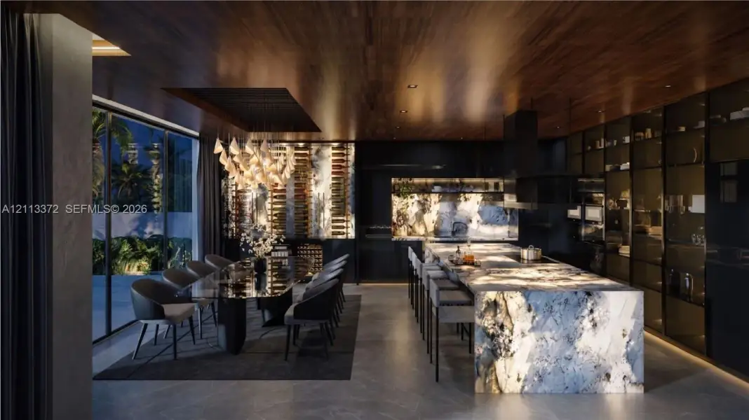 Expansive kitchen featuring a large stone waterfall island, custom full-height glass cabinetry, recessed ceiling paneling with wood finish, and a built-in temperature-controlled wine display