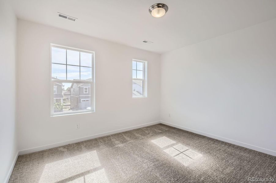 Spacious, unfurnished interior of a new home in Riano Ridge: The Monarch Collection, Loveland (Image 12).