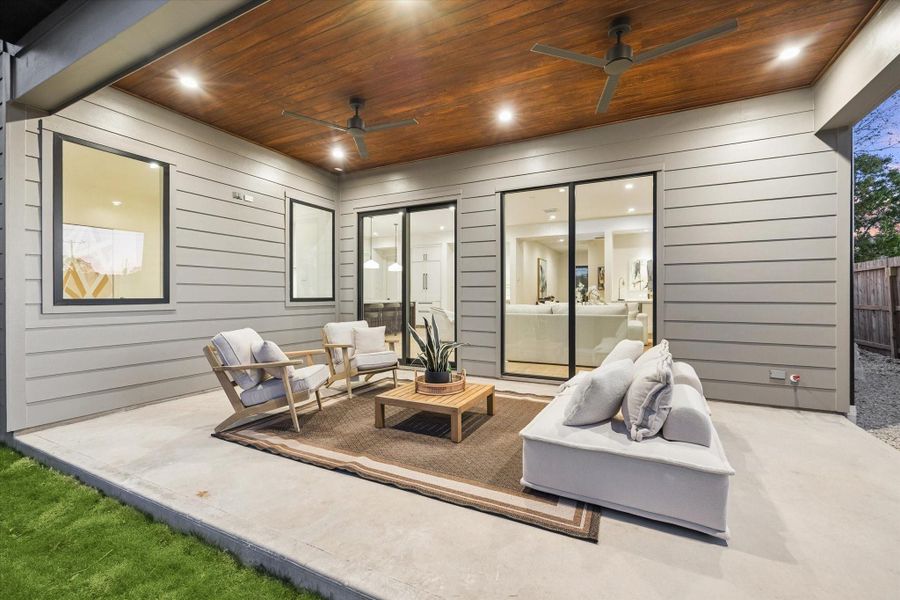 Enjoy the covered patio with recessed lighting, two ceiling fans, gas and TV connections, and a V-groove-stained ceiling. It is the perfect space for entertaining year-round.
