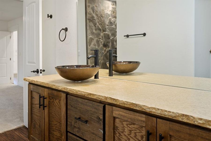 Bathroom with hardwood / wood-style flooring and vanity