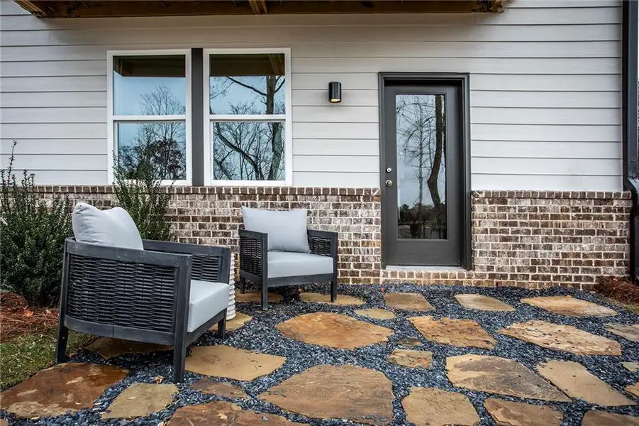 Exterior details and patio area of a home in Towne Village at Suwanee Dam, Sugar Hill (Image 22).
