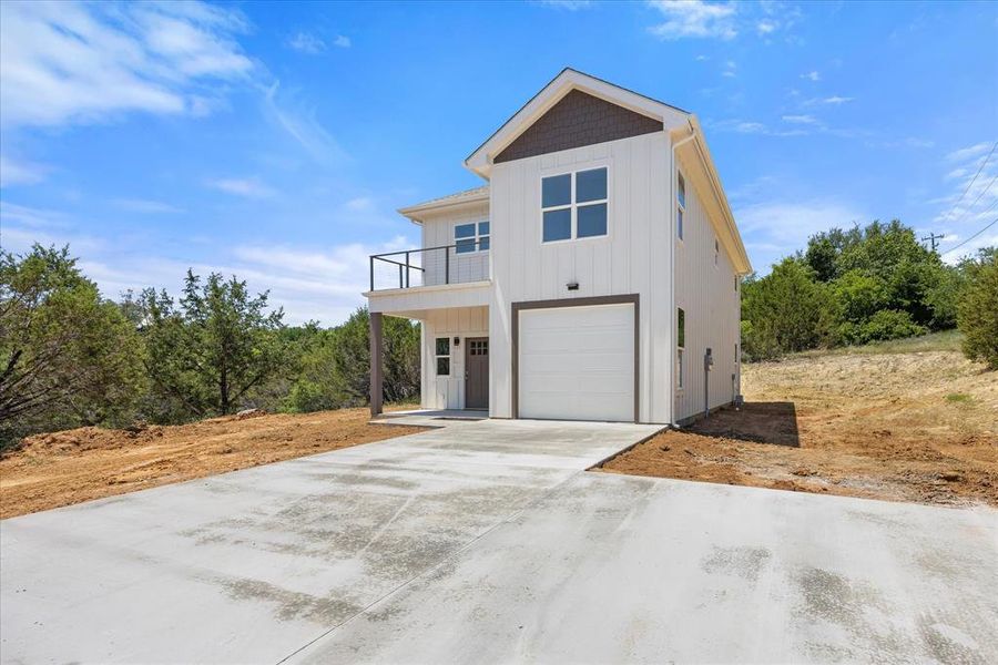 Front exterior of a new home in , Bluff Dale, TX, highlighting curb appeal (Image 20).