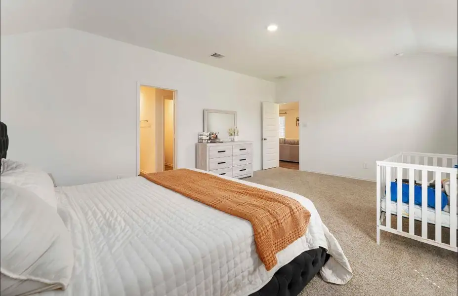 Another view of this spacious bedroom connects to an ensuite bathroom, a walk-in closet and hallway. Another view of this spacious bedroom connects to an ensuite bathroom, a walk-in closet and hallway.