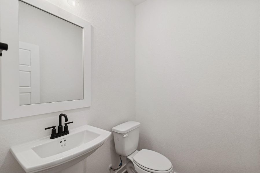 Furnished interior view inside a new home in Lone Star Landing, Montgomery (Image 9).