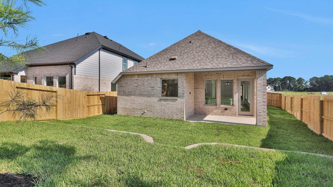 Exterior details and patio area of a home in The Woodlands Hills 40', Willis (Image 4). Exterior details and patio area of a home in The Woodlands Hills 40', Willis (Image 4).