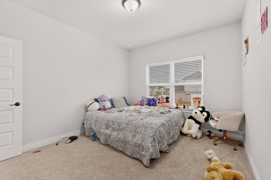 Bedroom featuring carpet flooring