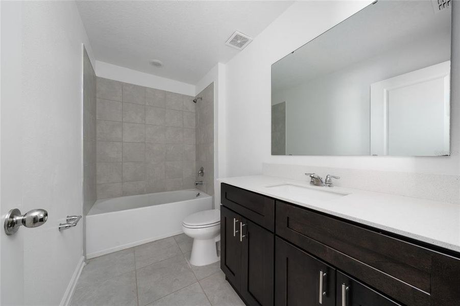 Furnished interior view inside a new home in Ranches at Lake Mcleod: Legacy Collection, Eagle Lake (Image 3).