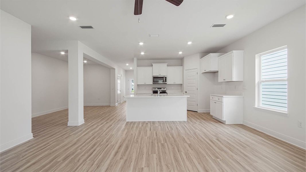 Representative furnished interior of a home built from the Kennedy by D.R. Horton in Bayside at Ward Creek, Panama City Beach (Image 11).