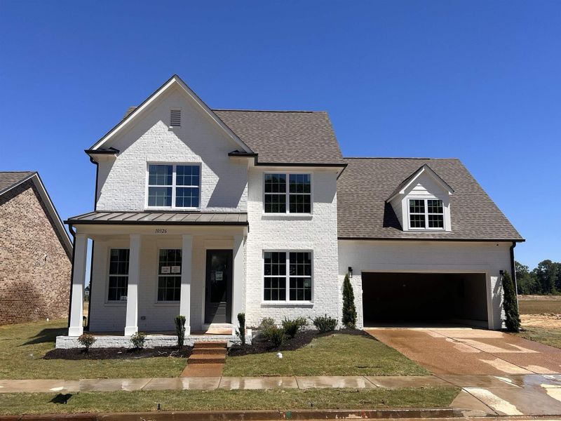 Front exterior of a new home in Lockwood, Collierville, TN, highlighting curb appeal (Image 1). Front exterior of a new home in Lockwood, Collierville, TN, highlighting curb appeal (Image 1).