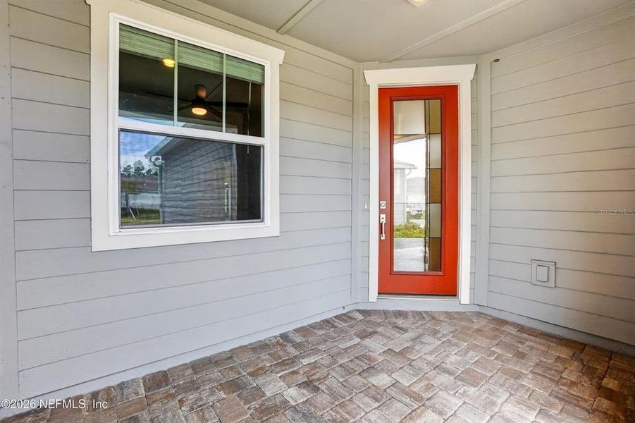 Exterior details and patio area of a home in Del Webb Wildlight, Wildlight (Image 27).