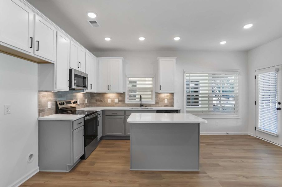 Representative furnished interior of a home built from the Khloe by KM Homes in The Cottages at Jackson Heights, Cleveland (Image 7).