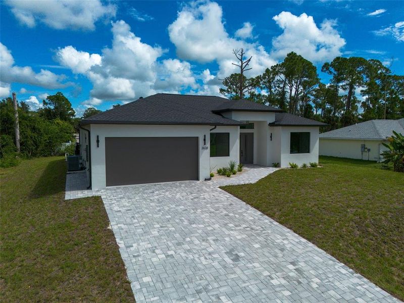 Front exterior of a new home in , North Port, FL, highlighting curb appeal (Image 30).