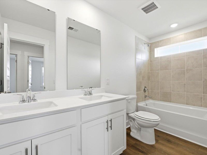Furnished interior view inside a new home in The Coves at Lakes of Cane Bay II, Summerville (Image 7).