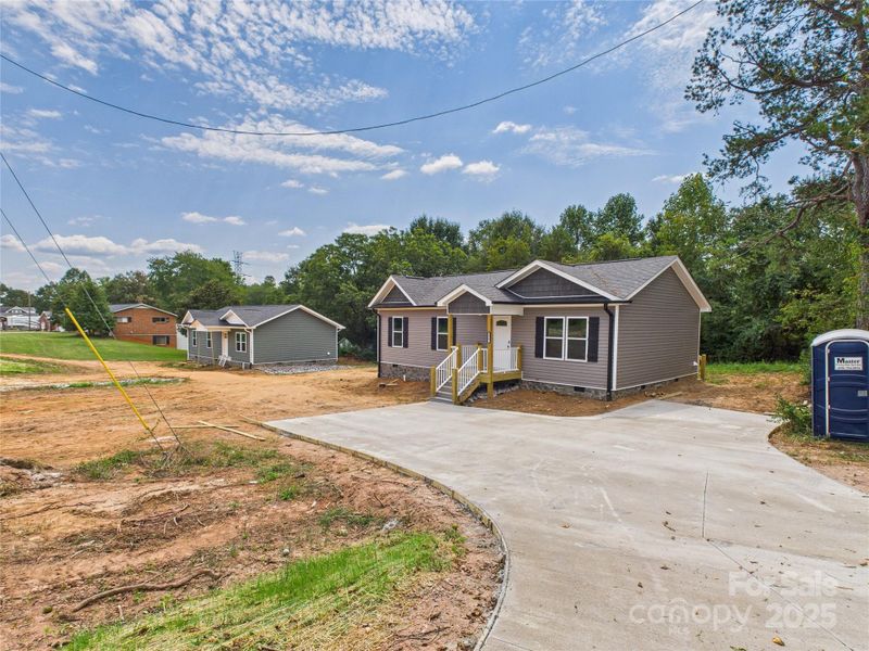 Front exterior of a new home in , Connelly Springs, NC, highlighting curb appeal (Image 21). Front exterior of a new home in , Connelly Springs, NC, highlighting curb appeal (Image 21).