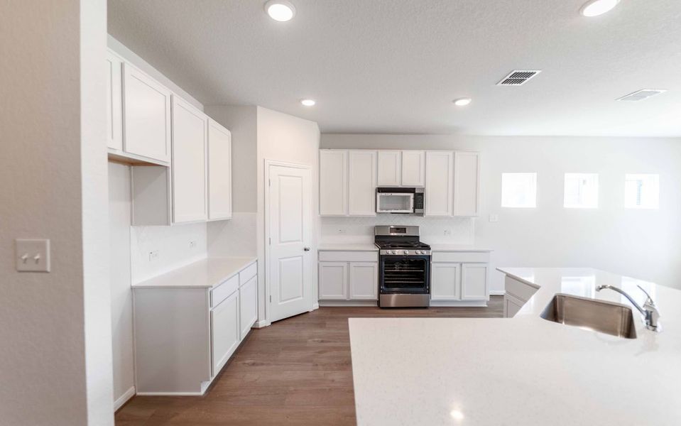 Furnished interior view inside a new home in Hennersby Hollow, San Antonio (Image 4).