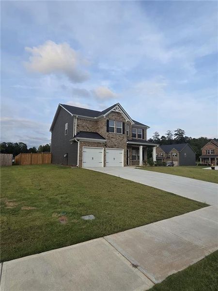 Front exterior of a new home in Fern Dale, Fairburn, GA, highlighting curb appeal (Image 35).
