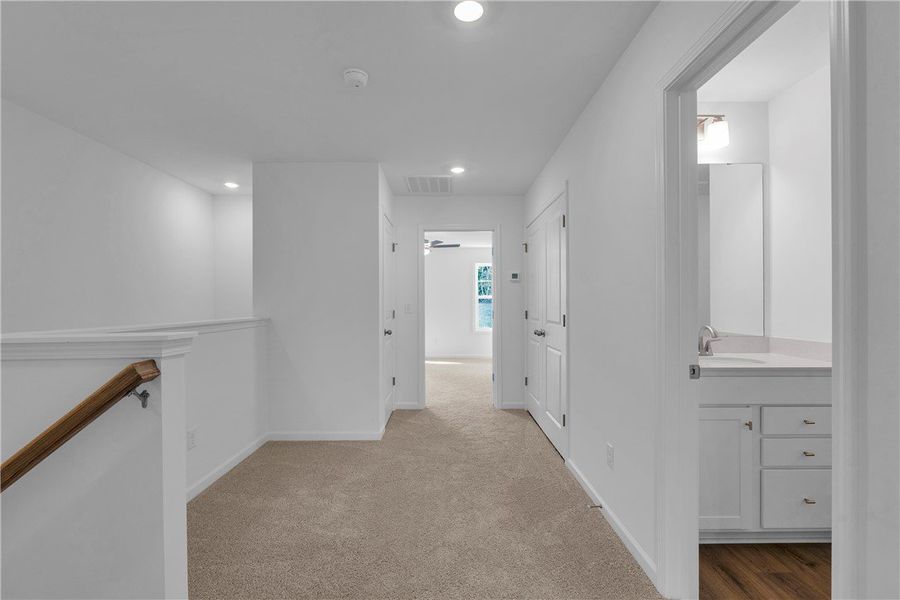 This bright hallway connects to a clean, well-appo This bright hallway connects to a clean, well-appo