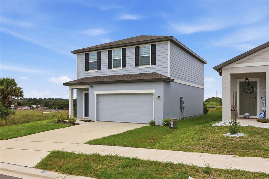 Front exterior of a new home in , Lake Hamilton, FL, highlighting curb appeal (Image 18). Front exterior of a new home in , Lake Hamilton, FL, highlighting curb appeal (Image 18).