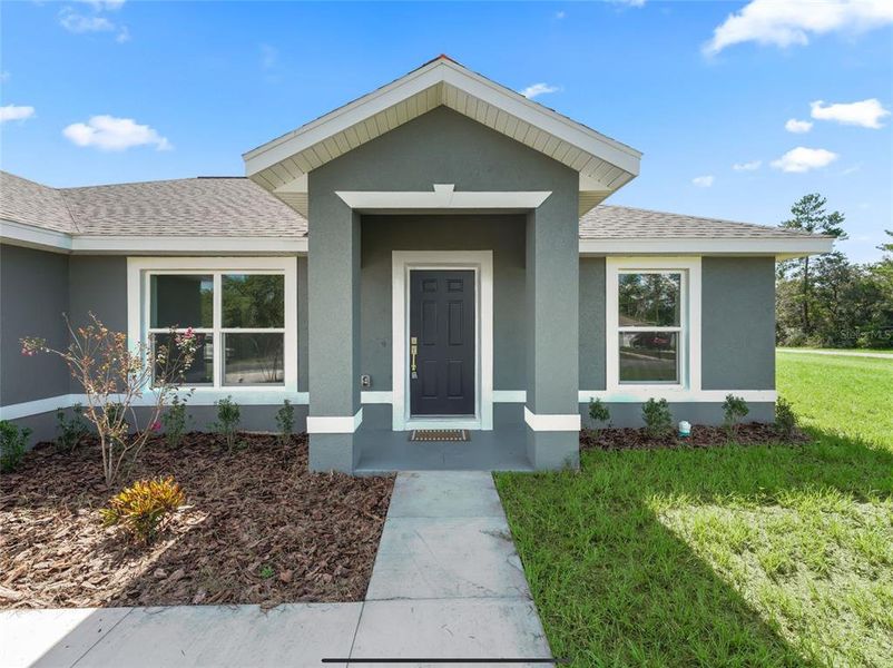 Front exterior of a new home in , Ocala, FL, highlighting curb appeal (Image 20).