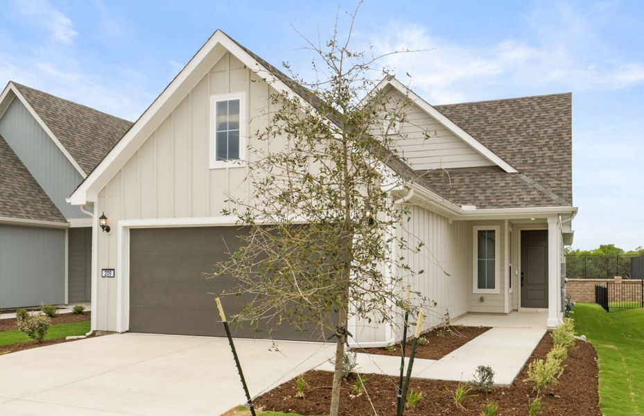 Front exterior of a new home in Sun City Texas, Georgetown, TX, highlighting curb appeal (Image 18).