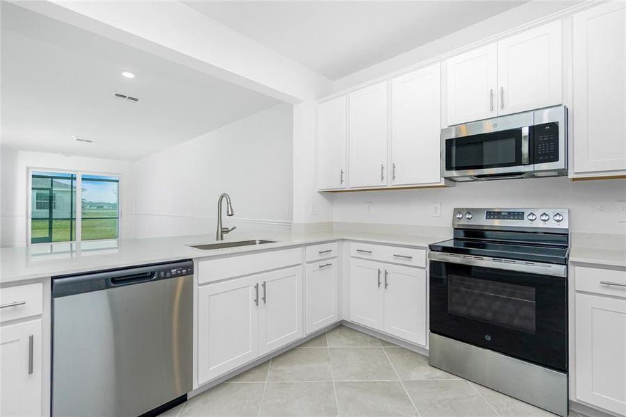 Furnished interior view inside a new home in Island Lakes at Coco Bay: Villas, Englewood (Image 15).