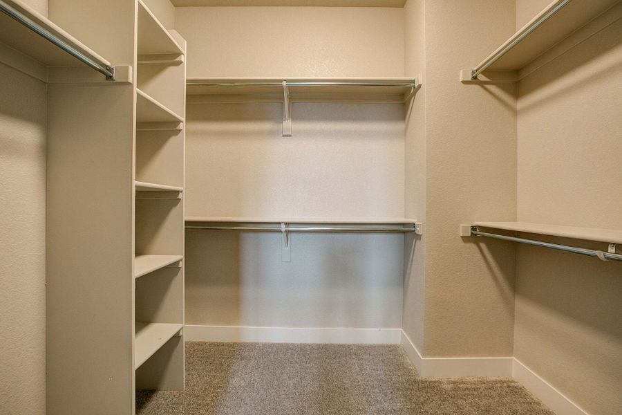 Primary Closet - Not Actual Home - Finishes May Vary