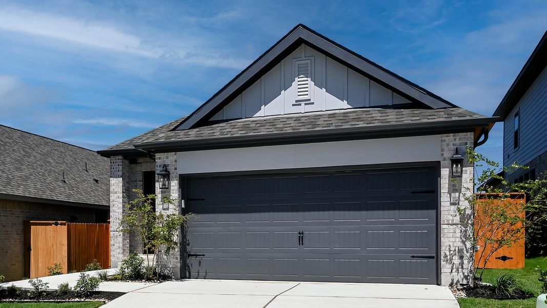 Garage featuring driveway Garage featuring driveway