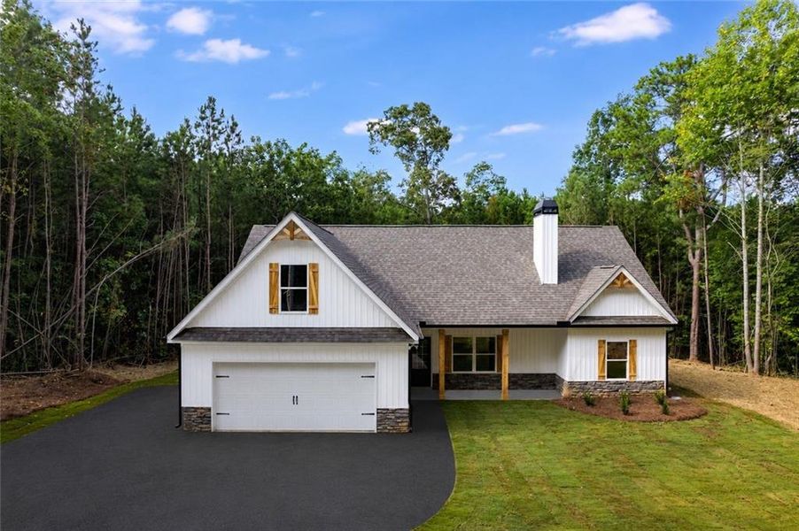 Front exterior of a new home in , Silver Creek, GA, highlighting curb appeal (Image 1). Front exterior of a new home in , Silver Creek, GA, highlighting curb appeal (Image 1).