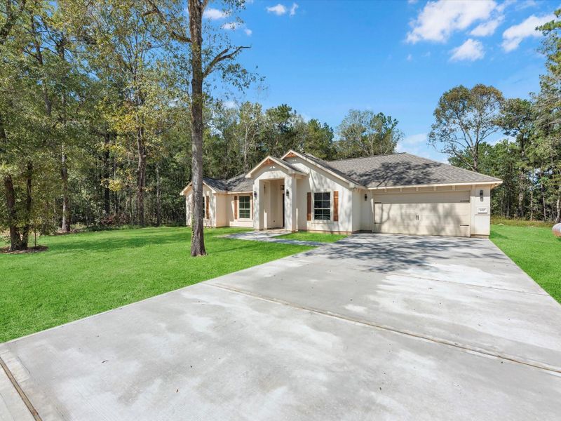 Front exterior of a new home in , Dayton, TX, highlighting curb appeal (Image 2).