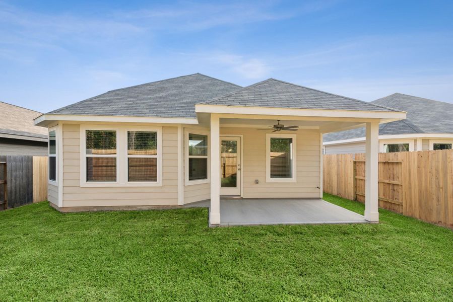Exterior details and patio area of a home in Pinewood at Grand Texas, New Caney (Image 2). Exterior details and patio area of a home in Pinewood at Grand Texas, New Caney (Image 2).