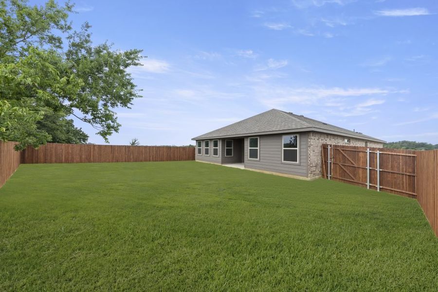 Front exterior of a new home in Belmont, Aubrey, TX, highlighting curb appeal (Image 26). Front exterior of a new home in Belmont, Aubrey, TX, highlighting curb appeal (Image 26).