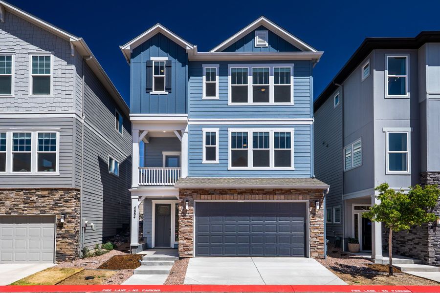 Front exterior of a new home in Trailside at Cottonwood Creek, Colorado Springs, CO, highlighting curb appeal (Image 1). Front exterior of a new home in Trailside at Cottonwood Creek, Colorado Springs, CO, highlighting curb appeal (Image 1).