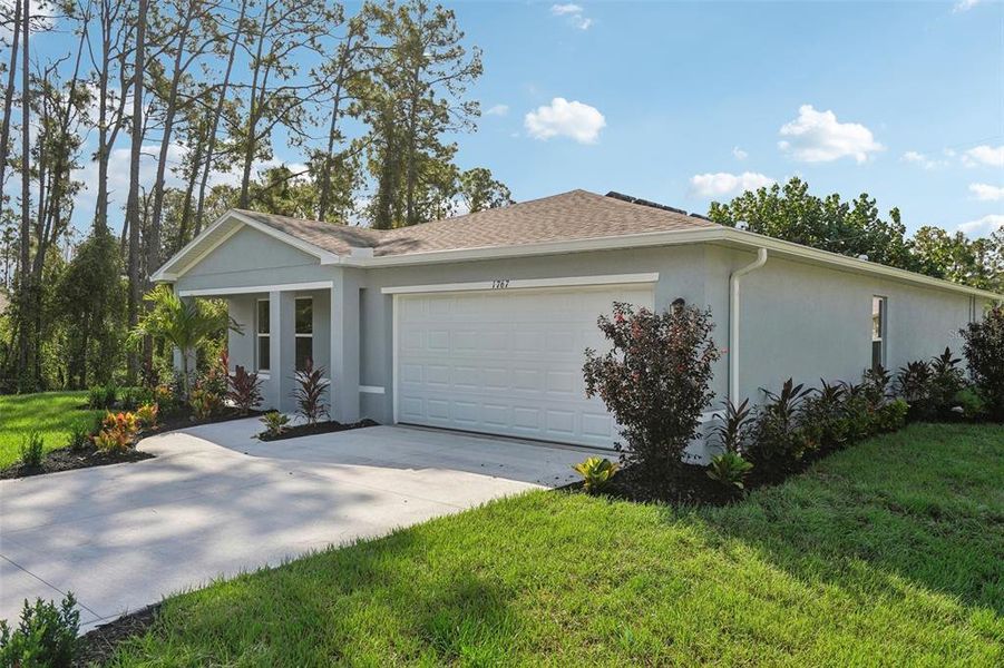 Front exterior of a new home in , Weeki Wachee, FL, highlighting curb appeal (Image 24).