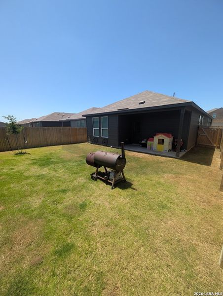 Exterior details and patio area of a home in Rose Valley, Converse (Image 26).