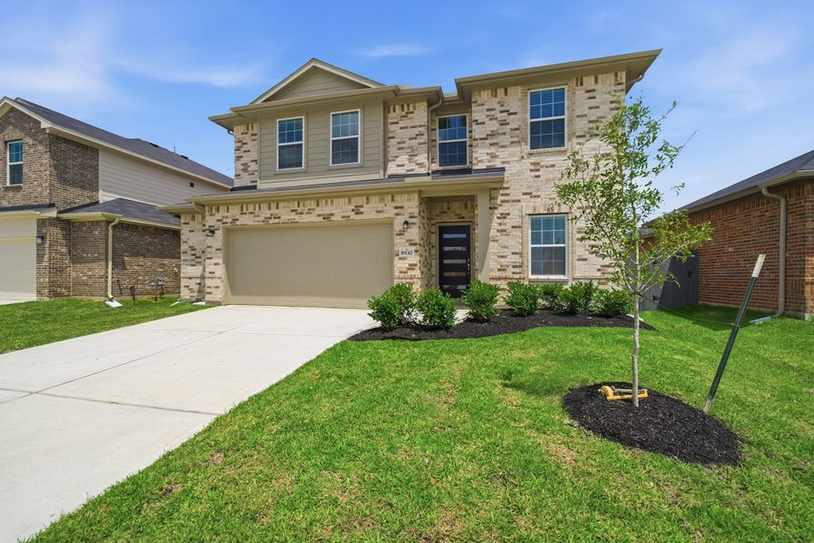 Front exterior of a new home in Bay Creek, Baytown, TX, highlighting curb appeal (Image 21).
