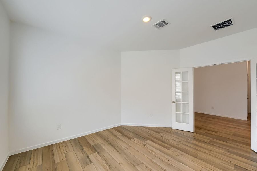 Elegant French doors enhance privacy.