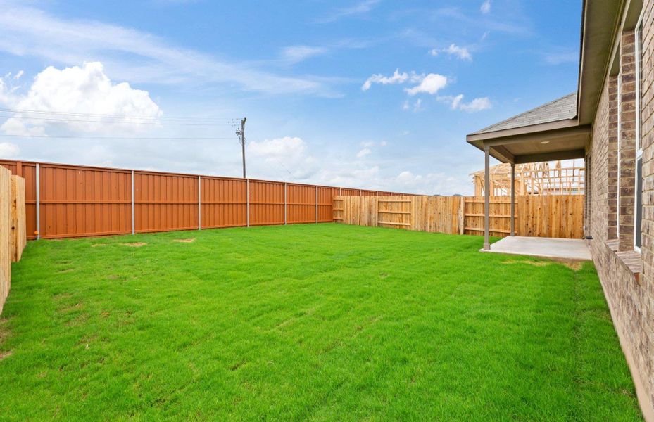 Front exterior of a new home in Sunfield, Buda, TX, highlighting curb appeal (Image 2). Front exterior of a new home in Sunfield, Buda, TX, highlighting curb appeal (Image 2).
