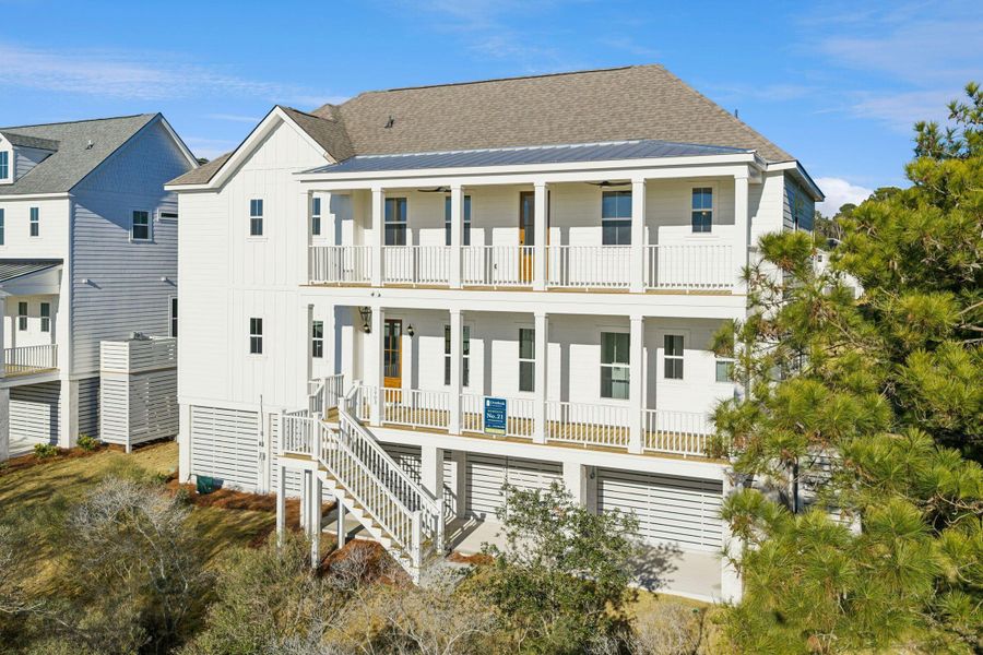 Exterior details and patio area of a home in Overlook at Copahee Sound, Awendaw (Image 42).