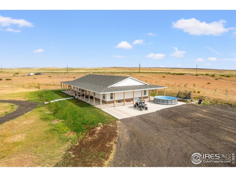 Front exterior of a new home in , Weldona, CO, highlighting curb appeal (Image 24).