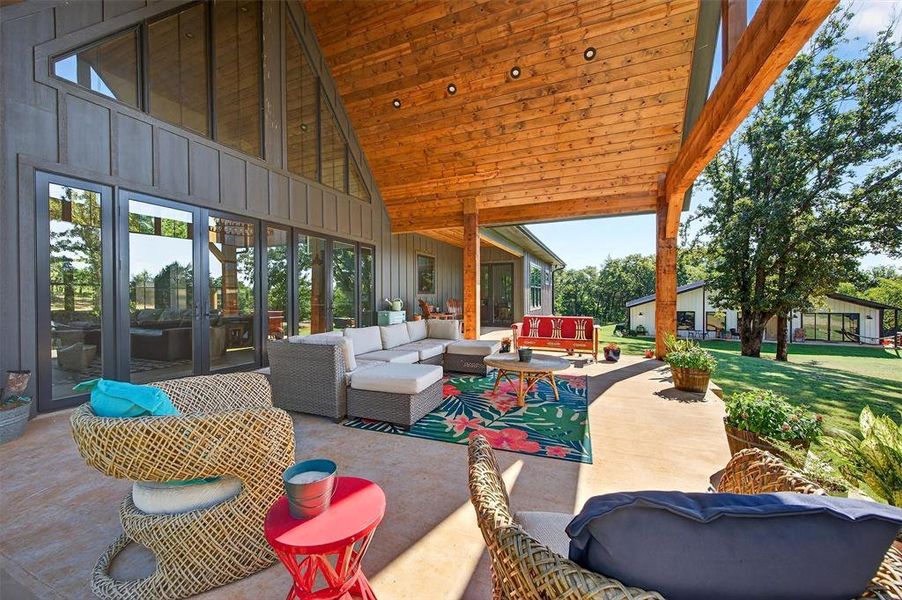 View of patio / terrace featuring an outdoor living space and french doors View of patio / terrace featuring an outdoor living space and french doors