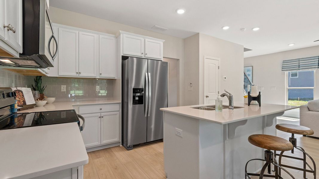 Representative furnished interior of a home built from the Reagan by DRB Homes in Towne Center, Hampton (Image 16).