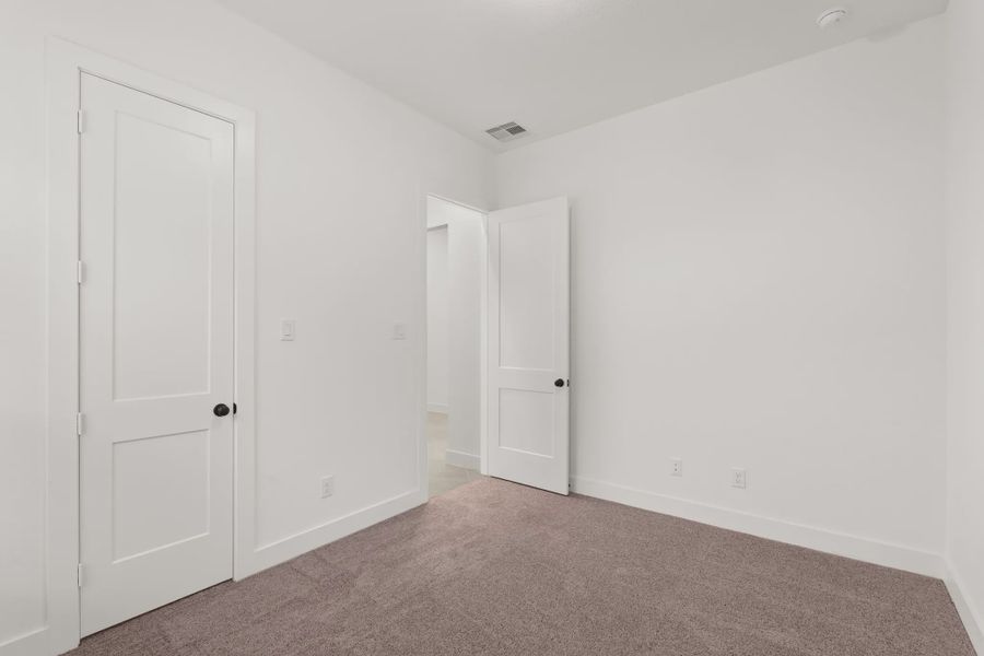 Representative unfurnished interior of a home built from the Palmer by Chesmar Homes in Riceland Alley Loads, Mont Belvieu (Image 36).