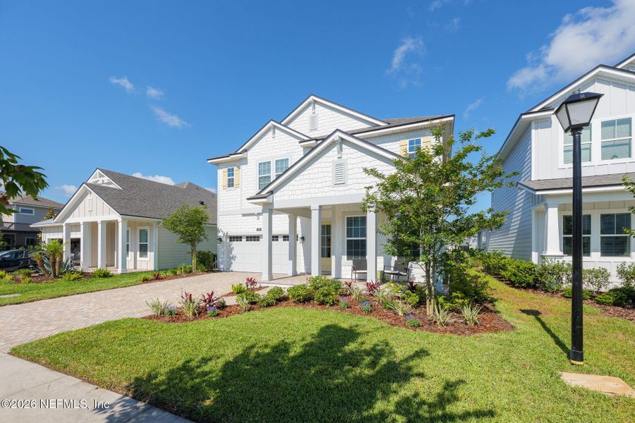 Front exterior of a new home in Seabrook Village at Seabrook, Ponte Vedra, FL, highlighting curb appeal (Image 33).