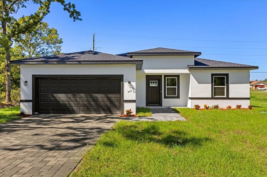 Front exterior of a new home in , Ocala, FL, highlighting curb appeal (Image 21).