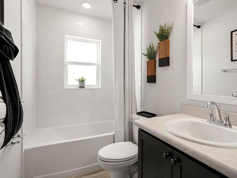 Secondary bedrooms share a convenient hall bath - Parker by Highland Homes Secondary bedrooms share a convenient hall bath - Parker by Highland Homes
