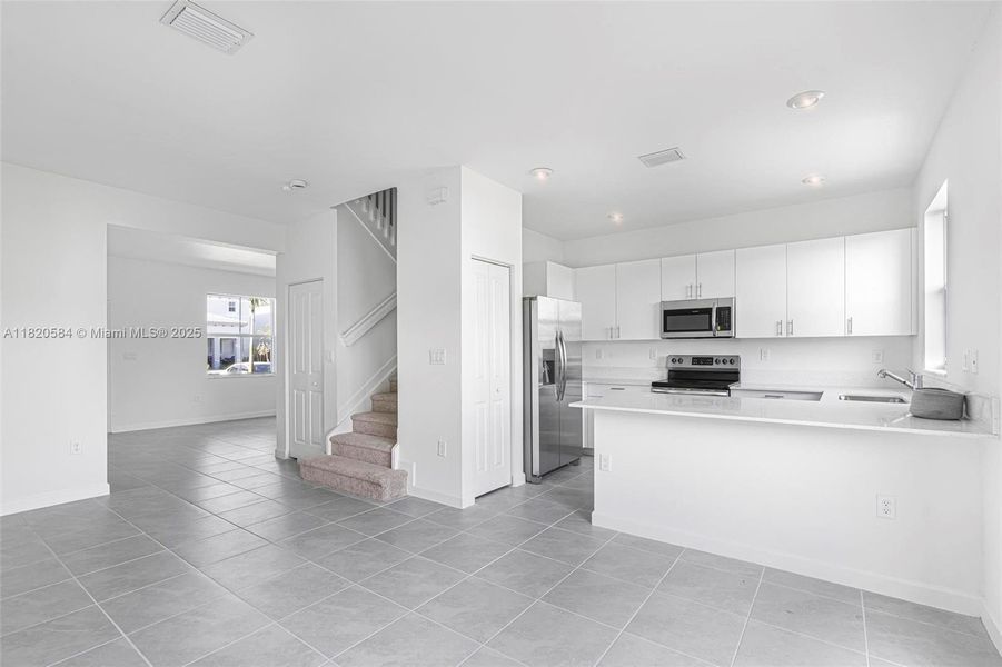 Furnished interior view inside a new home in Cedar Pointe: Cypress Collection, Homestead (Image 10). Furnished interior view inside a new home in Cedar Pointe: Cypress Collection, Homestead (Image 10).