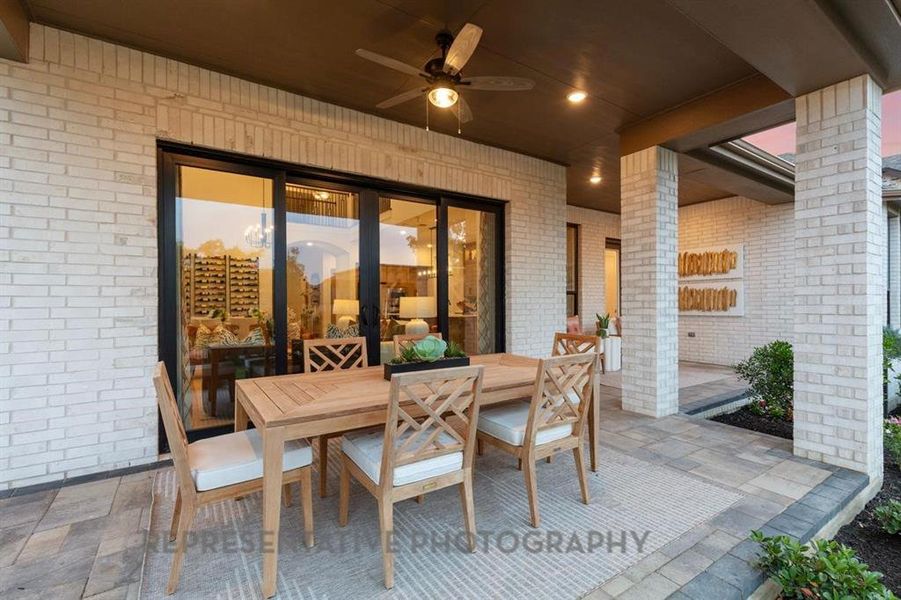 View of patio featuring outdoor dining space and a ceiling fan View of patio featuring outdoor dining space and a ceiling fan