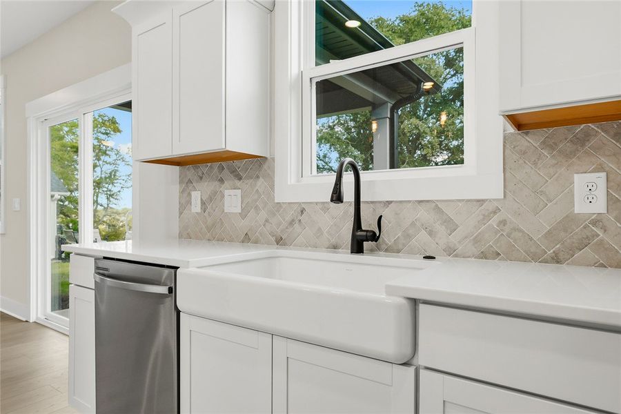 An elegant farmhouse sink pairs beautifully with c