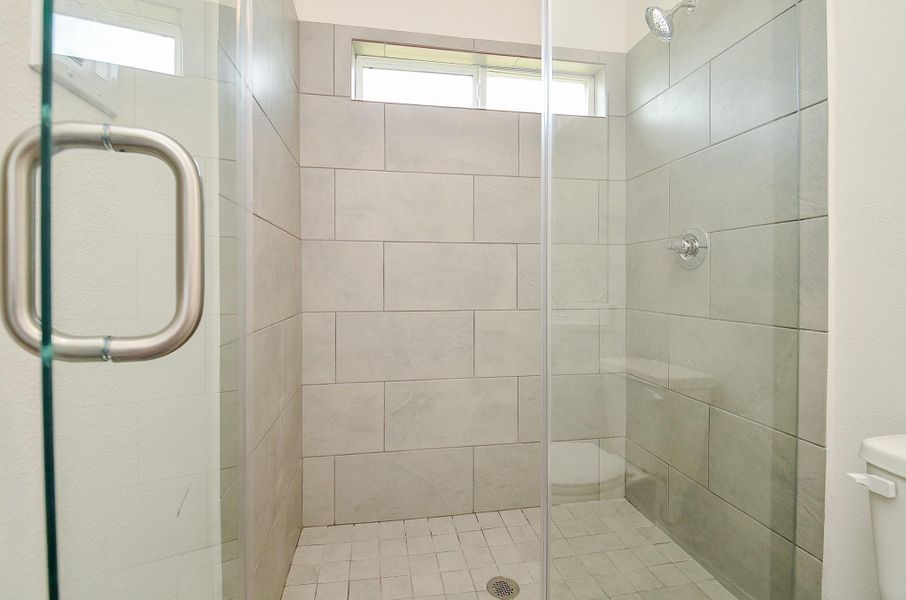 Notice this gorgeous shower with a beautiful tile wall. Notice this gorgeous shower with a beautiful tile wall.